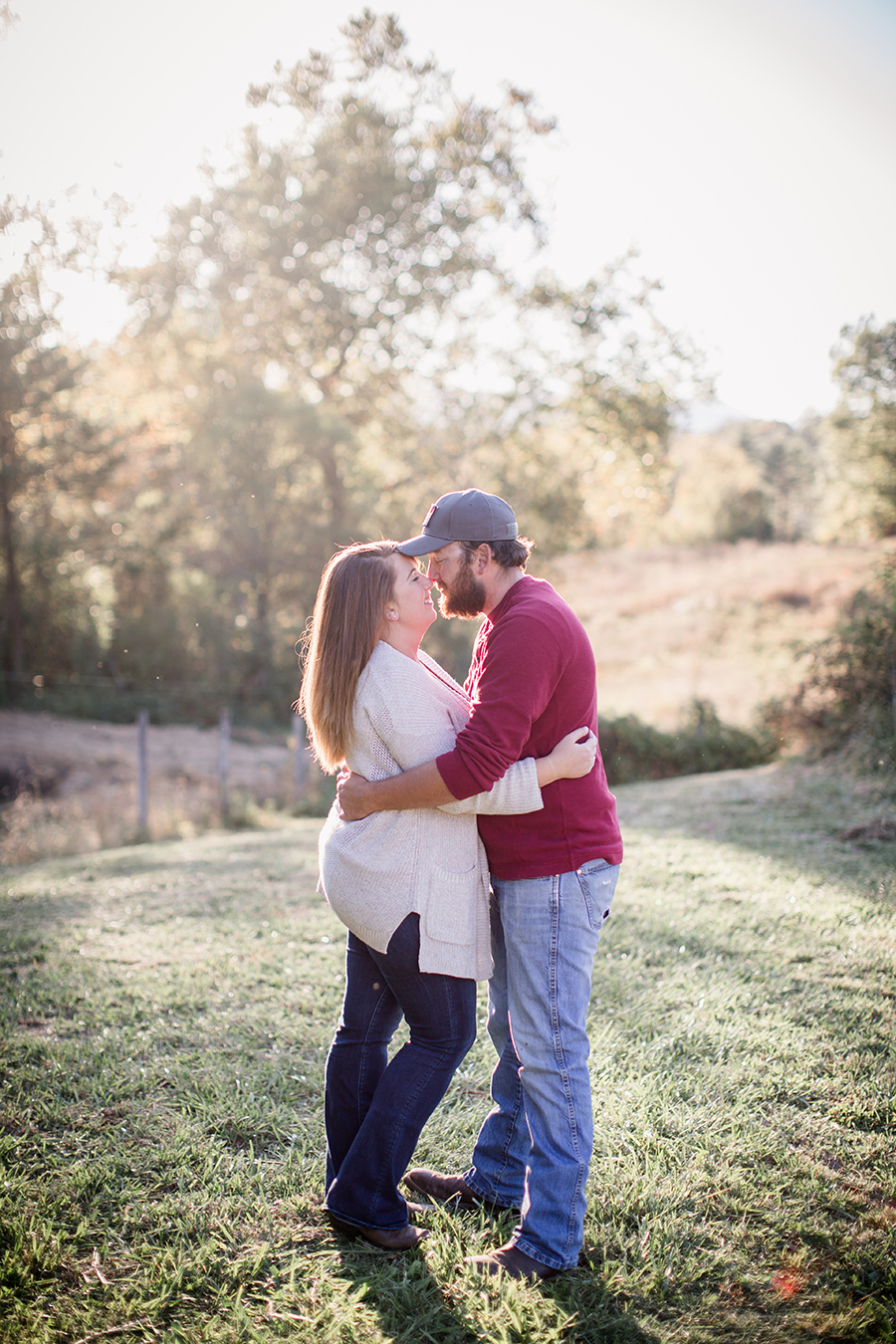 Kissing in the light by Knoxville Wedding Photographer, Amanda May Photos.
