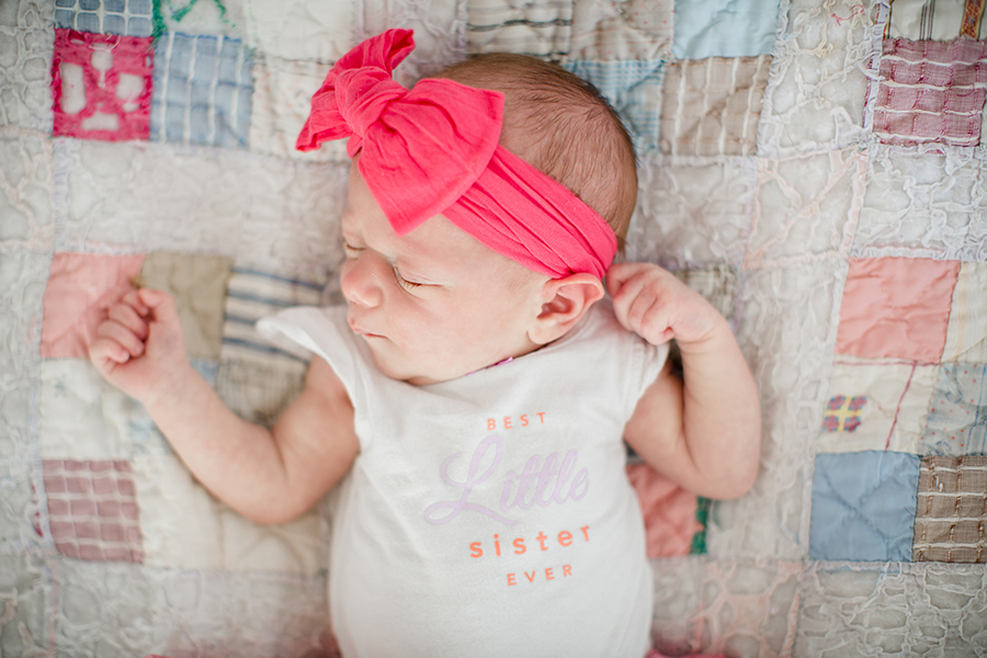 Pink bow on a quilt by Knoxville Wedding Photographer, Amanda May Photos.