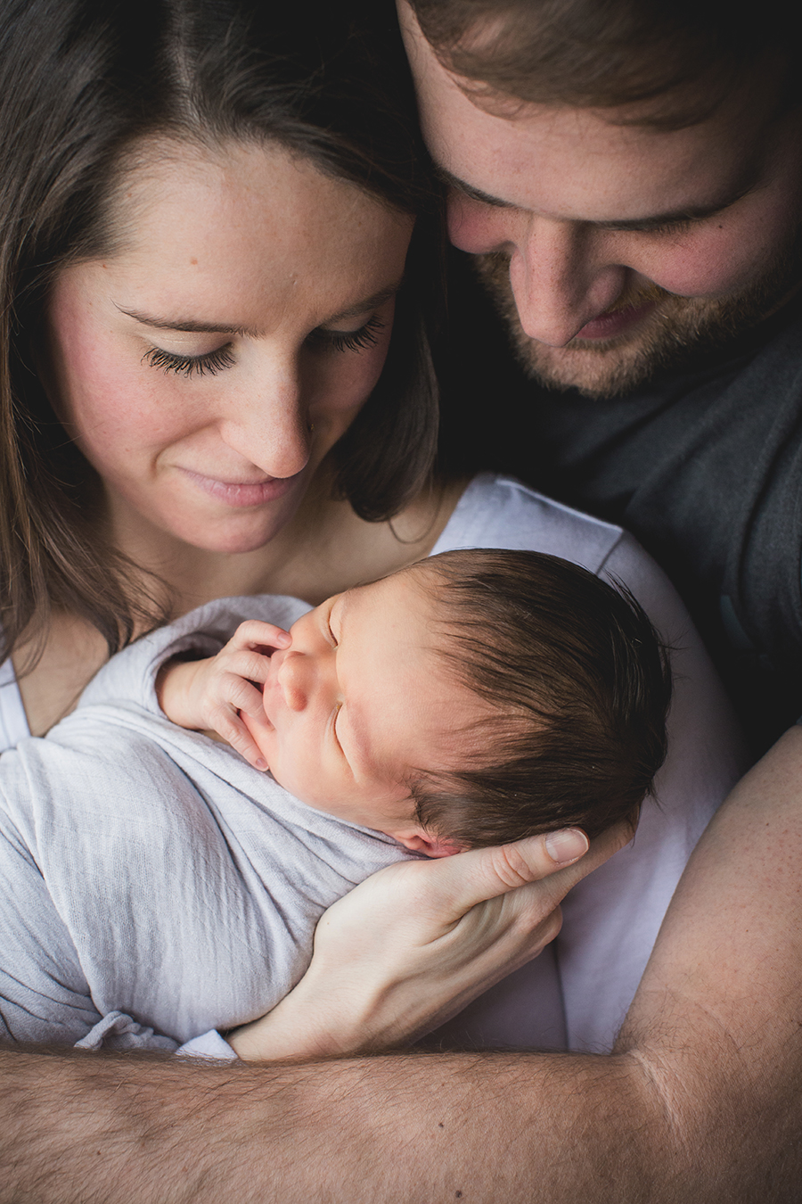 Mom and dad holding baby boy by Knoxville Wedding Photographer, Amanda May Photos.