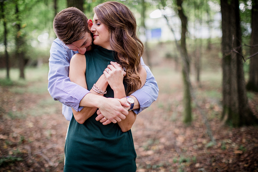 Her arms tucked under his by Knoxville Wedding Photographer, Amanda May Photos.
