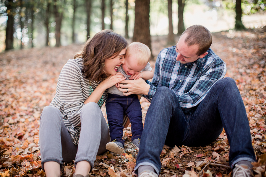 Mom and dad playing with little boy by Knoxville Wedding Photographer, Amanda May Photos.