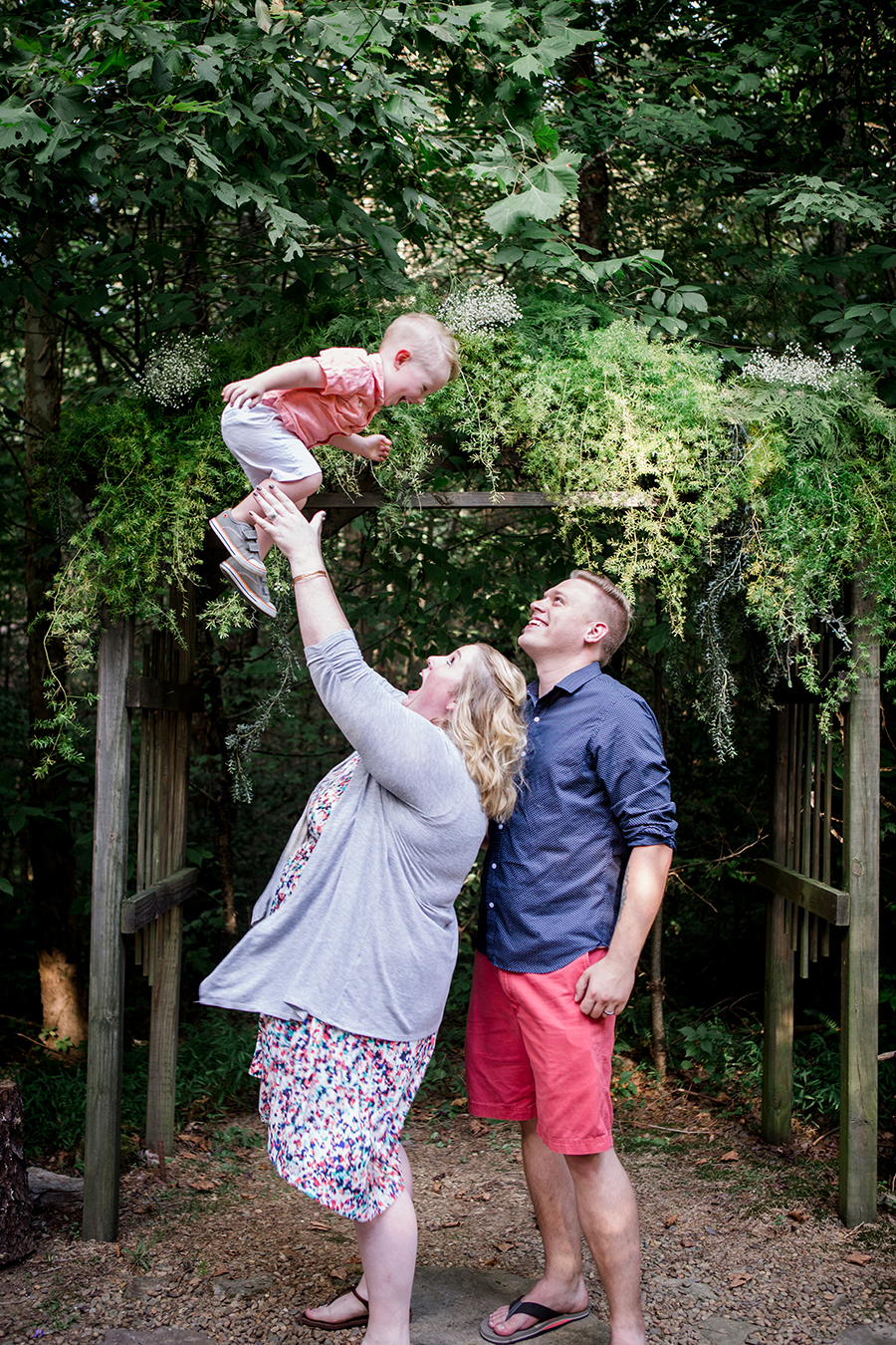Throwing little boy in the air by Knoxville Wedding Photographer, Amanda May Photos.