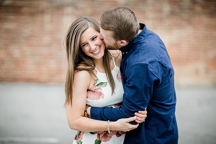 Kiss on the cheek at this 2018 favorite engagements by Knoxville Wedding Photographer, Amanda May Photos.