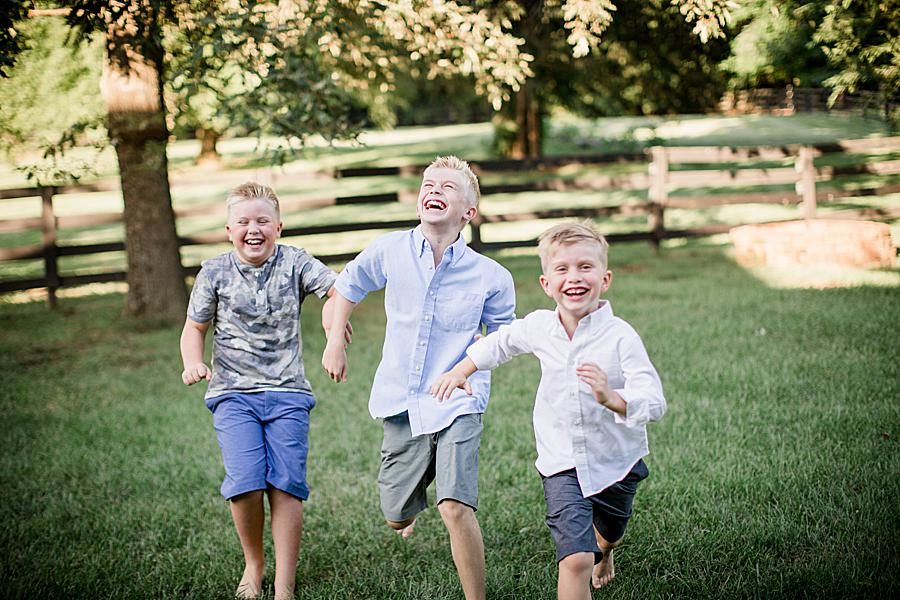 Boys running at this 2018 Favorite Portraits by Knoxville Wedding Photographer, Amanda May Photos.