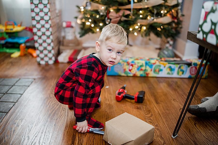 playing with Christmas toys at this Family by Knoxville Wedding Photographer, Amanda May Photos.