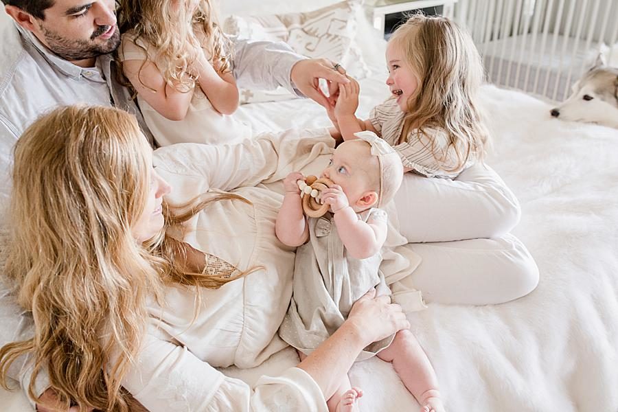 Sisters playing at this Lifestyle 6 Month Session by Knoxville Wedding Photographer, Amanda May Photos.