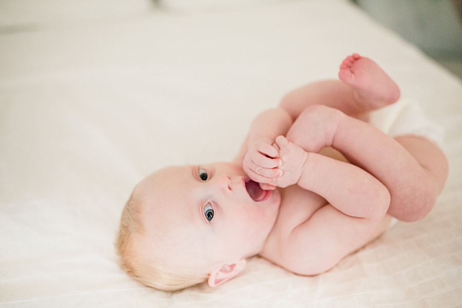 baby eating toes 6 month session
