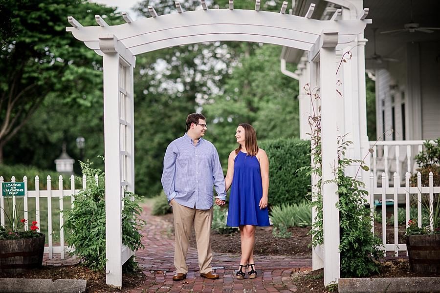 Under the pergola at this Whitestone Country Inn Engagement Session by Knoxville Wedding Photographer, Amanda May Photos.