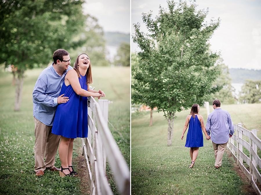 Laughing by the pasture at this Whitestone Country Inn Engagement Session by Knoxville Wedding Photographer, Amanda May Photos.