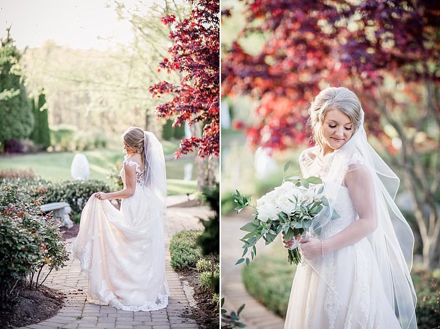 Holding the dress at this Castleton Farms Bridal session by Knoxville Wedding Photographer, Amanda May Photos.