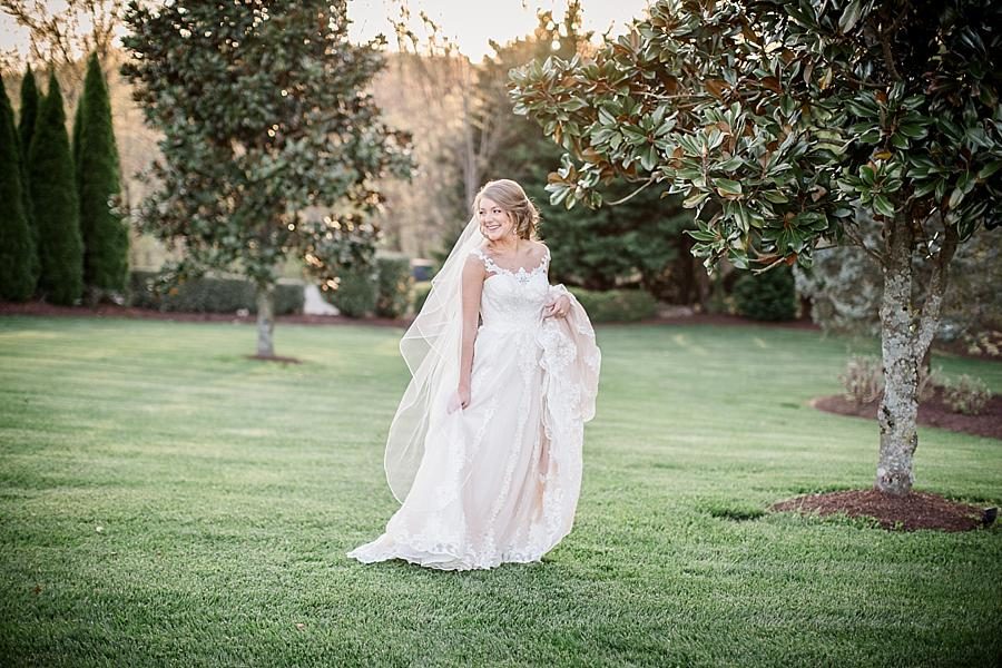 By the magnolia at this Castleton Farms Bridal session by Knoxville Wedding Photographer, Amanda May Photos.