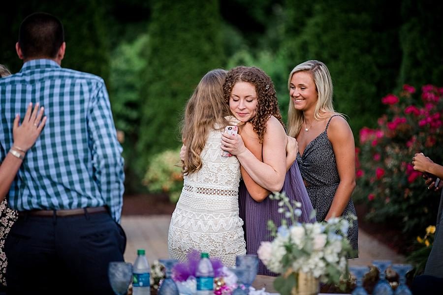 Hugging the guests at this Castleton Farms Wedding by Knoxville Wedding Photographer, Amanda May Photos.