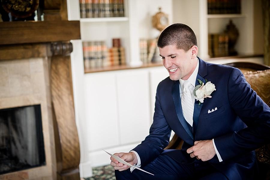 Groom reading a letter at this Castleton Farms Wedding by Knoxville Wedding Photographer, Amanda May Photos.