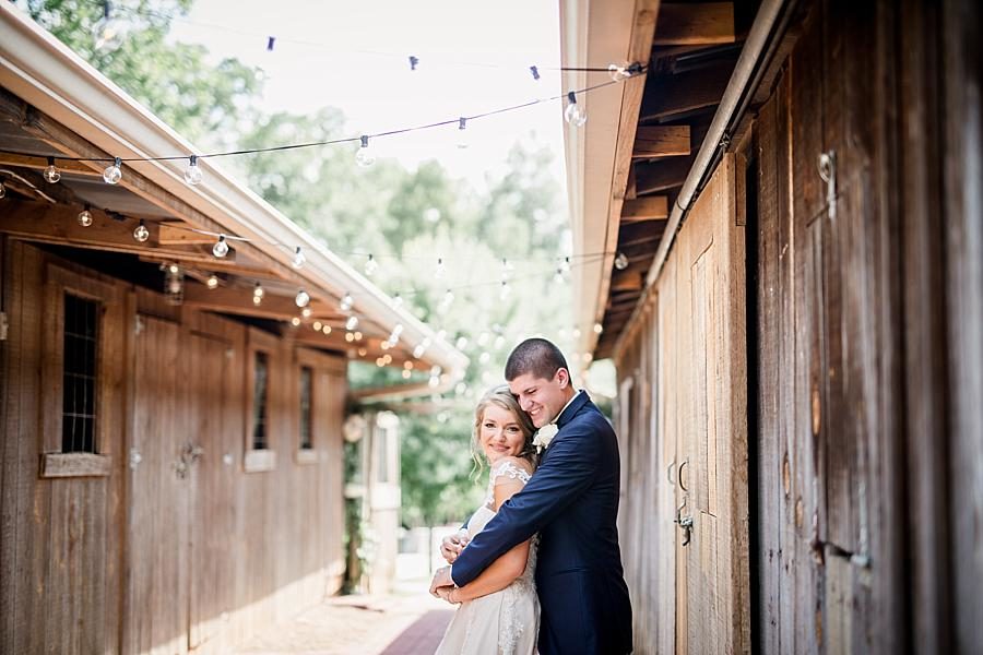 Hug from behind at this Castleton Farms Wedding by Knoxville Wedding Photographer, Amanda May Photos.
