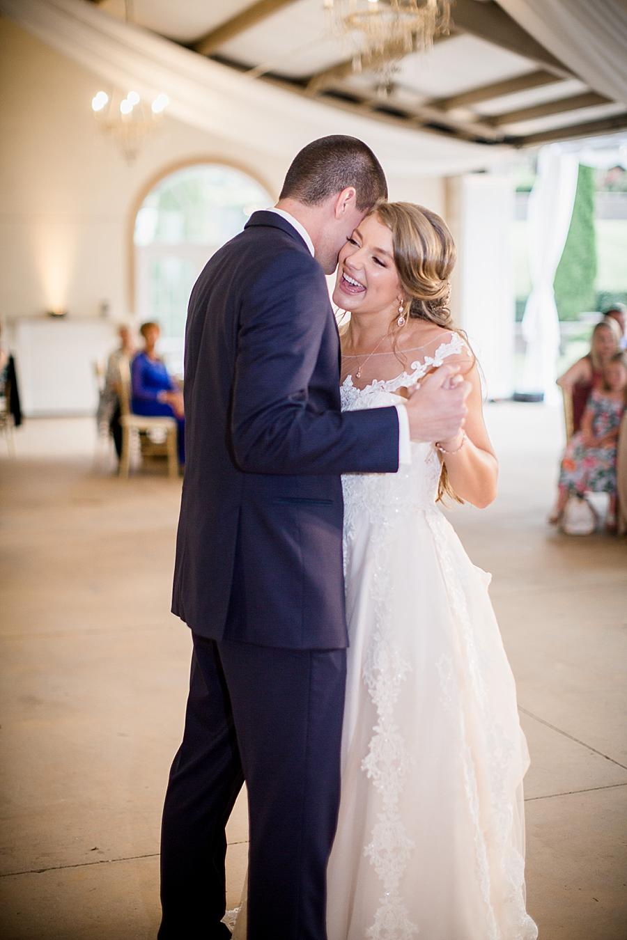 Whispering in her ear at this Castleton Farms Wedding by Knoxville Wedding Photographer, Amanda May Photos.