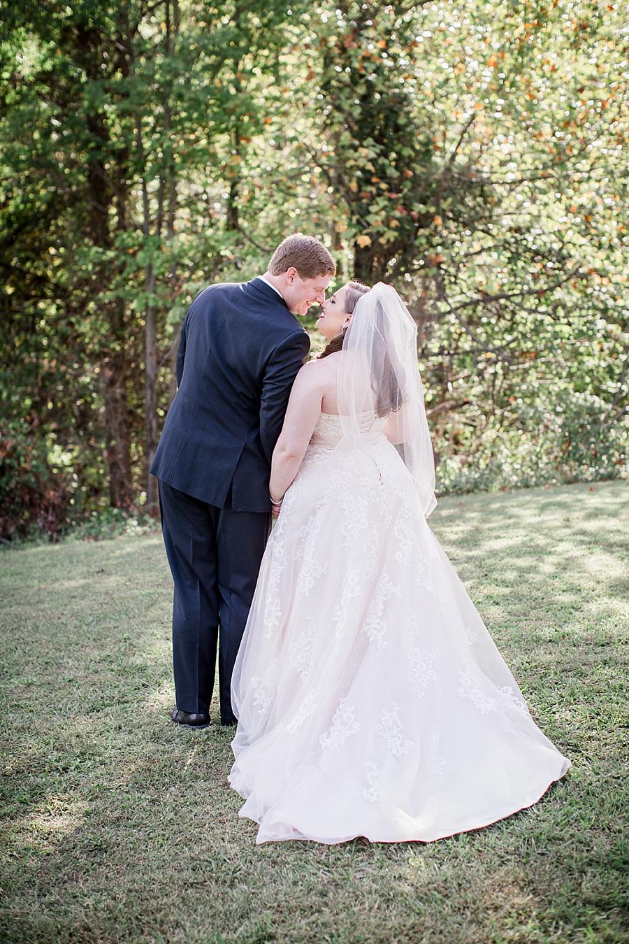 Kissing from behind at this Christopher Place wedding by Knoxville Wedding Photographer, Amanda May Photos