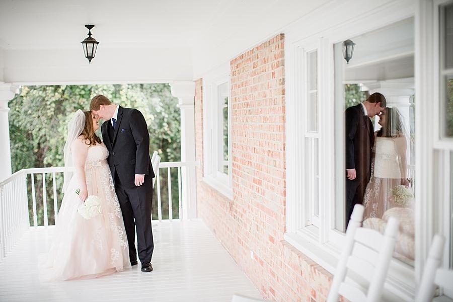 Secret kisses at this Christopher Place wedding by Knoxville Wedding Photographer, Amanda May Photos