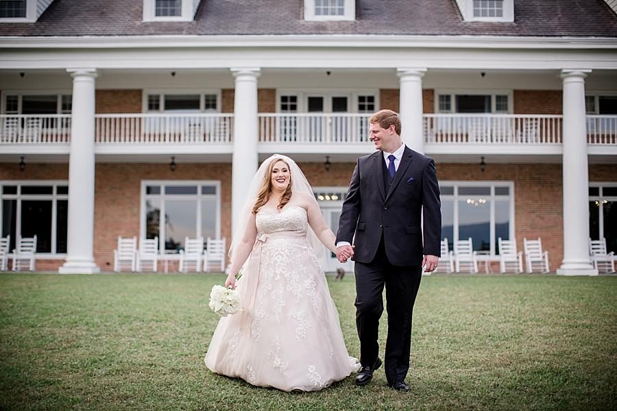 Bride and groom walking at this Christopher Place wedding by Knoxville Wedding Photographer, Amanda May Photos