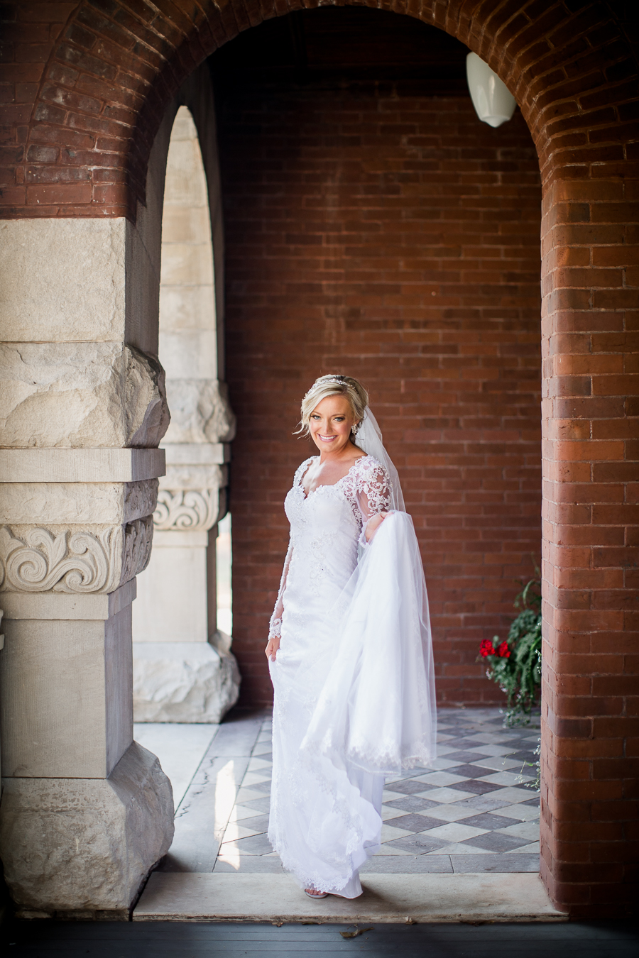 Holding her train at Historic Westwood by Knoxville Wedding Photographer, Amanda May Photos.