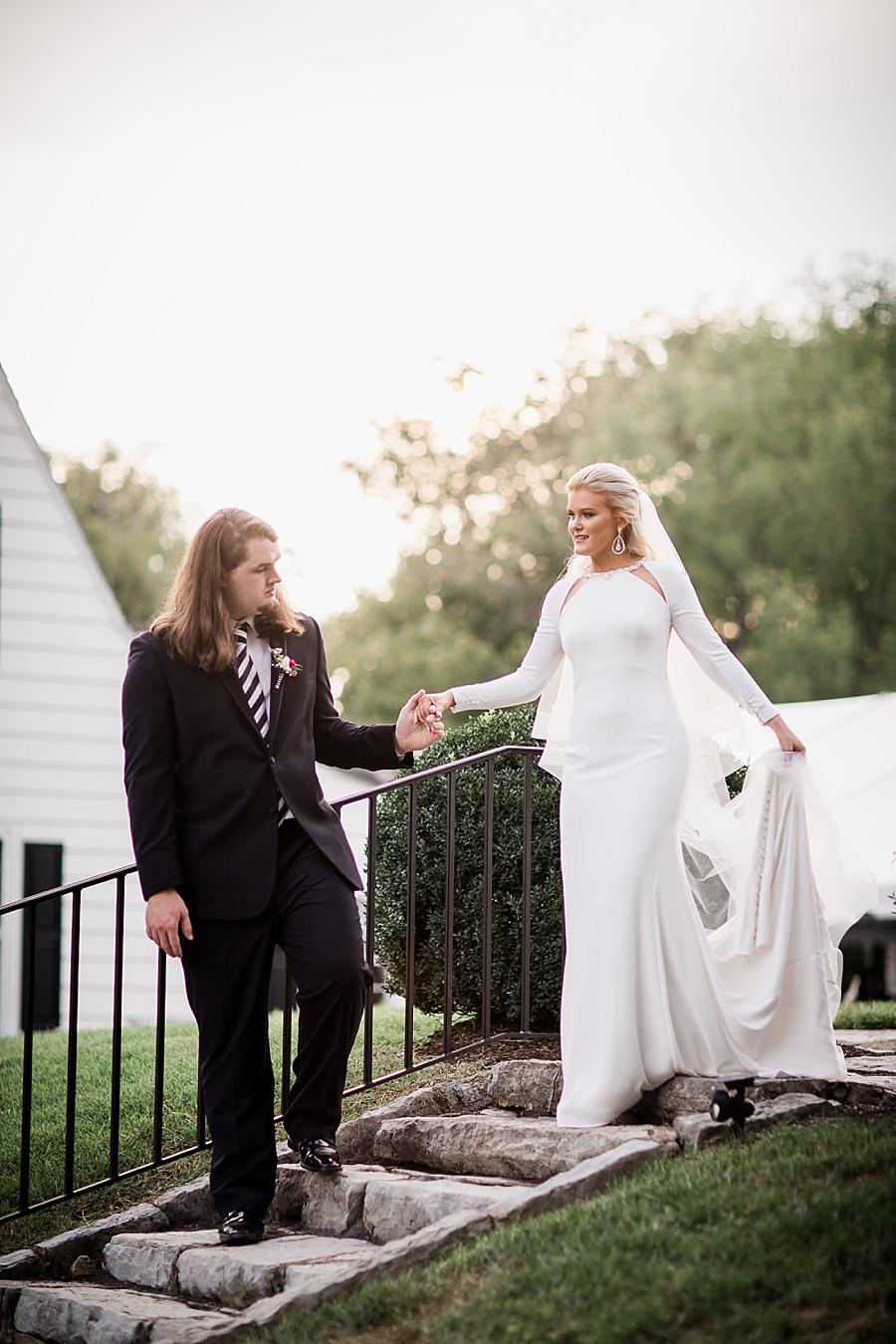 Helping his bride at this Kincaid House Wedding by Knoxville Wedding Photographer, Amanda May Photos.
