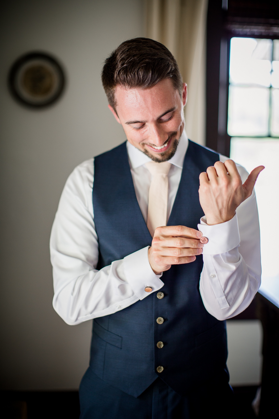 Fixing sleeve links at this North Carolina Elopement by Knoxville Wedding Photographer, Amanda May Photos.