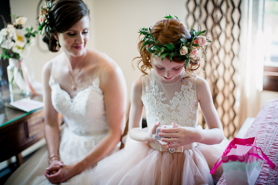 Daughter excitedly putting on gift from Groom at this North Carolina Elopement by Knoxville Wedding Photographer, Amanda May Photos.