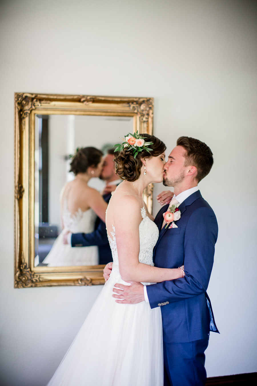 Kissing each other in front of mirror at this North Carolina Elopement by Knoxville Wedding Photographer, Amanda May Photos.
