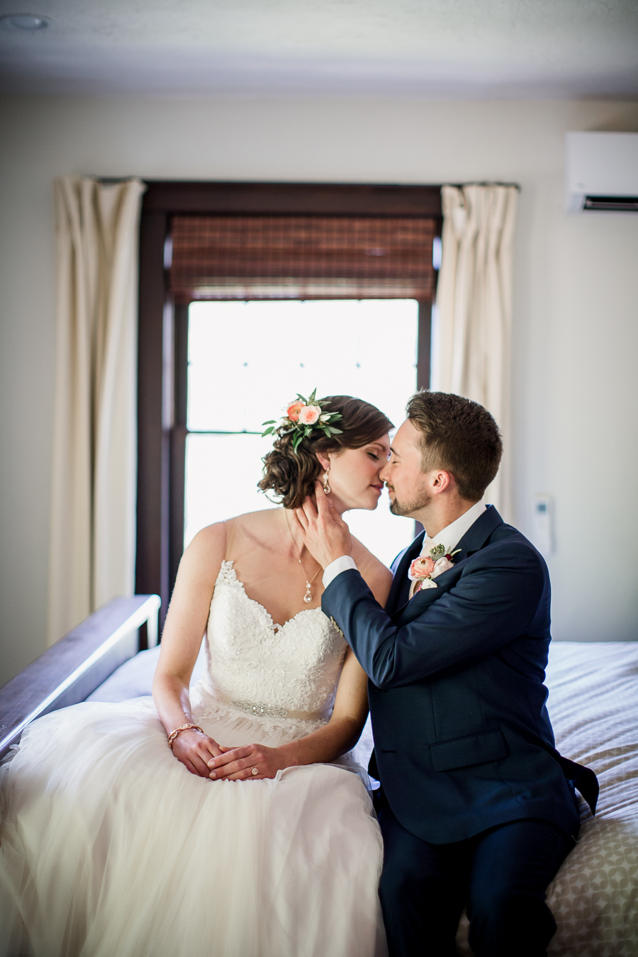 Bride and Groom kissing on bed at this North Carolina Elopement by Knoxville Wedding Photographer, Amanda May Photos.