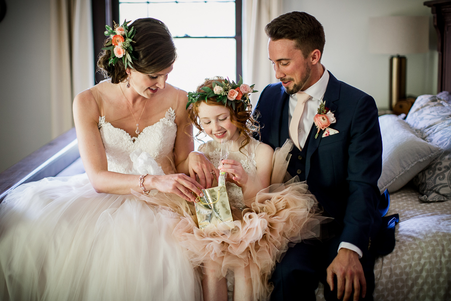 Daughter helping open gift at this North Carolina Elopement by Knoxville Wedding Photographer, Amanda May Photos.