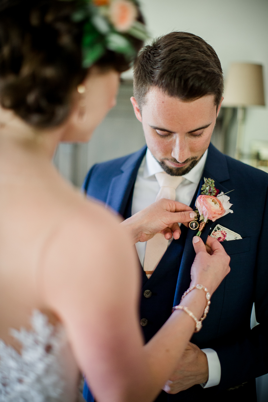 Bride putting flower on Groom at this North Carolina Elopement by Knoxville Wedding Photographer, Amanda May Photos.