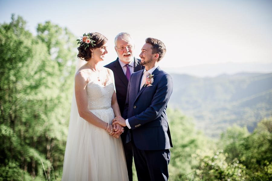 Holding hands smiling at this North Carolina Elopement by Knoxville Wedding Photographer, Amanda May Photos.