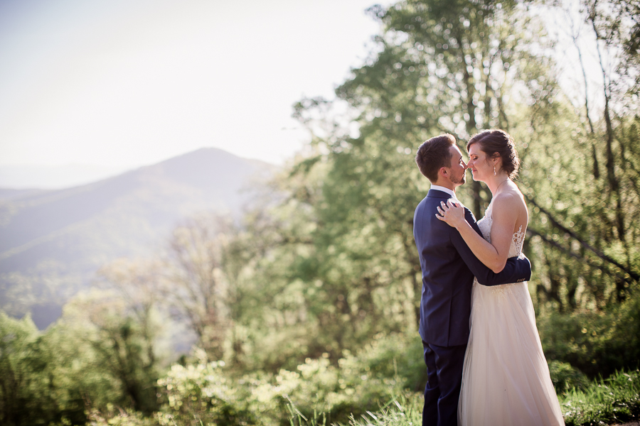 Looking at each other in front of mountains at this North Carolina Elopement by Knoxville Wedding Photographer, Amanda May Photos.