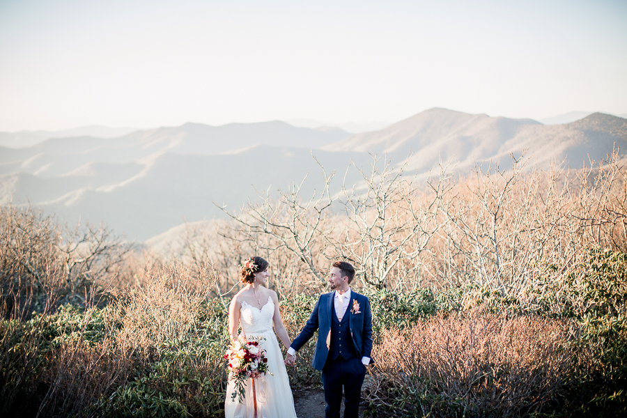 Holding hands in mountains at this North Carolina Elopement by Knoxville Wedding Photographer, Amanda May Photos.