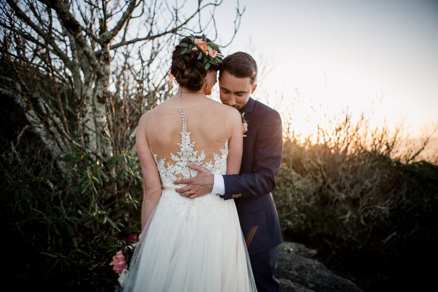 Bride and Groom hugging in front of sunset at this North Carolina Elopement by Knoxville Wedding Photographer, Amanda May Photos.