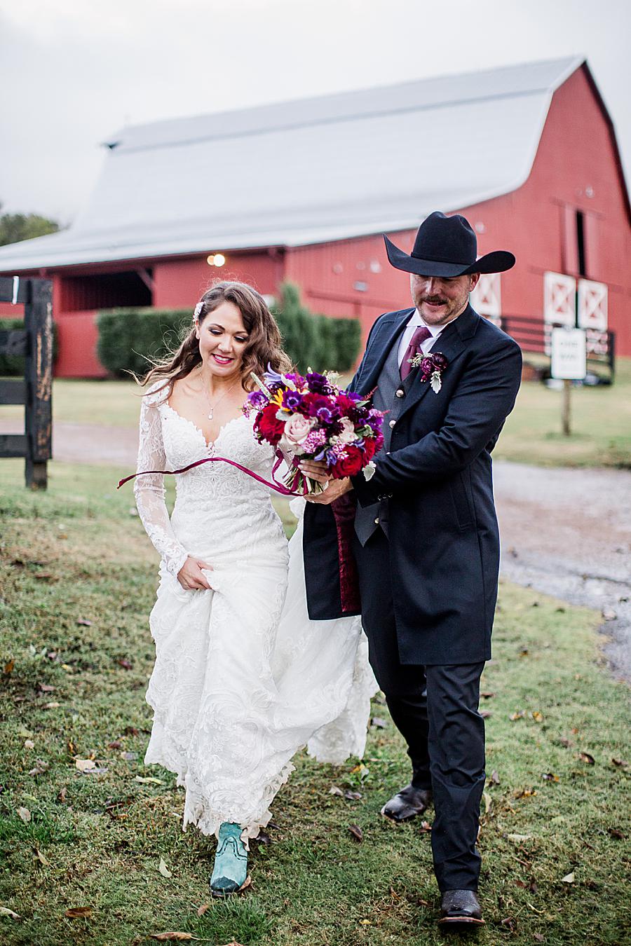 Groom holding bouquet at this Arrington Vineyard wedding by Knoxville Wedding Photographer, Amanda May Photos.
