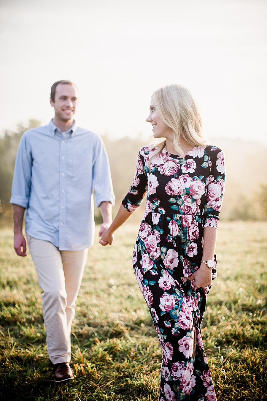 Walking together at this Family Farm Engagement Session by Knoxville Wedding Photographer, Amanda May Photos.