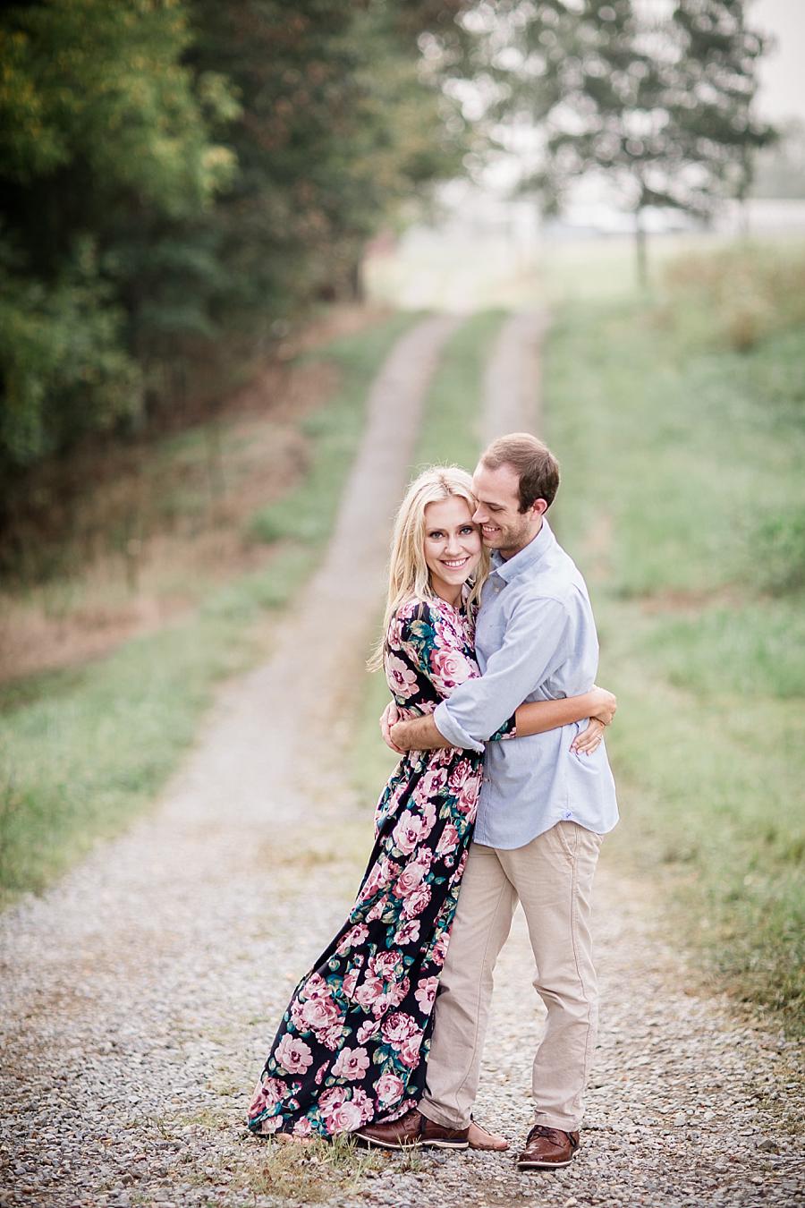 Arms wrapped around waist at this Family Farm Engagement Session by Knoxville Wedding Photographer, Amanda May Photos.