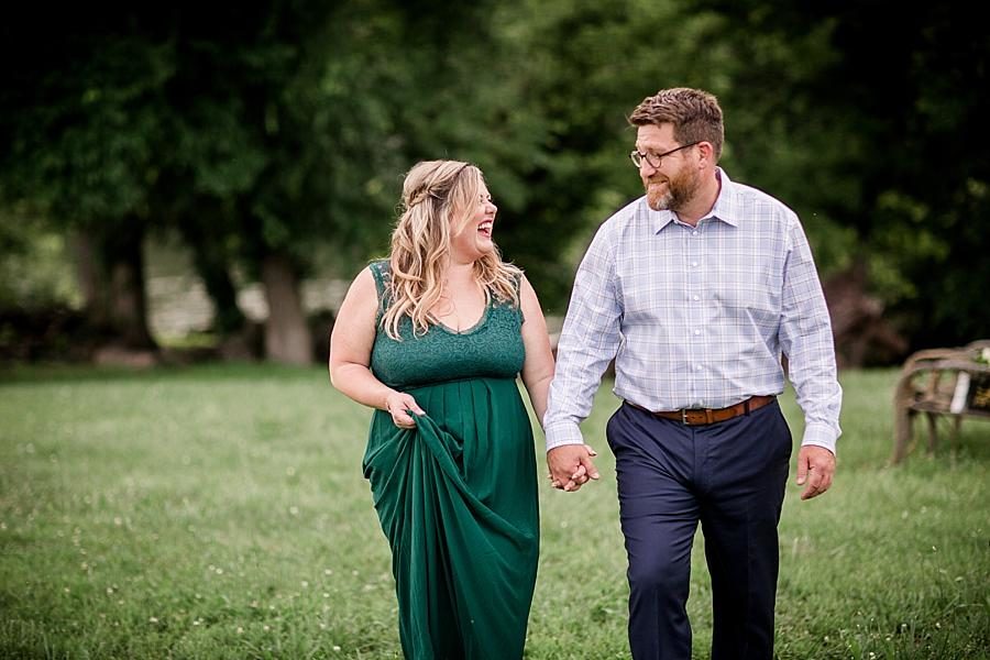 Holding hands at this Holston River Engagement Session by Knoxville Wedding Photographer, Amanda May Photos.