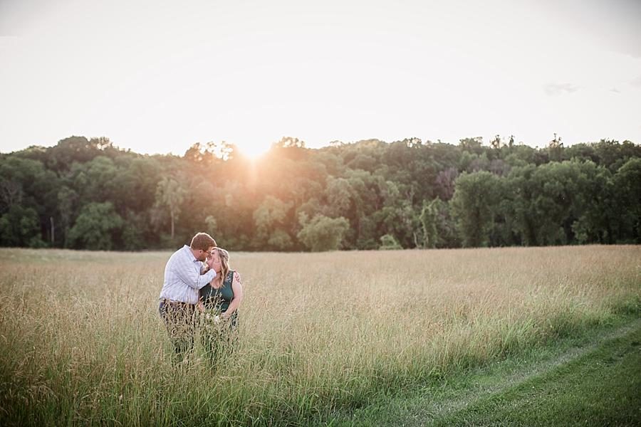 Field kisses at this Holston River Engagement Session by Knoxville Wedding Photographer, Amanda May Photos.