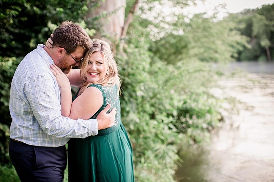 Arm around neck at this Holston River Engagement Session by Knoxville Wedding Photographer, Amanda May Photos.