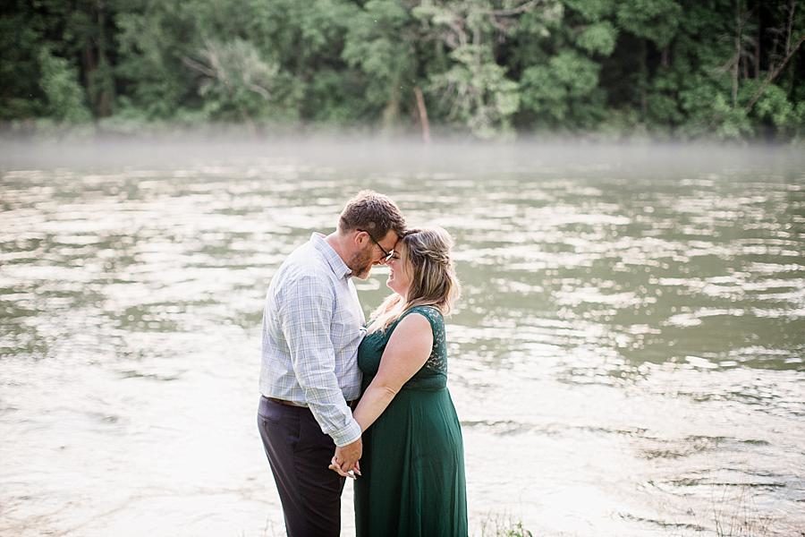 Touching foreheads at this Holston River Engagement Session by Knoxville Wedding Photographer, Amanda May Photos.