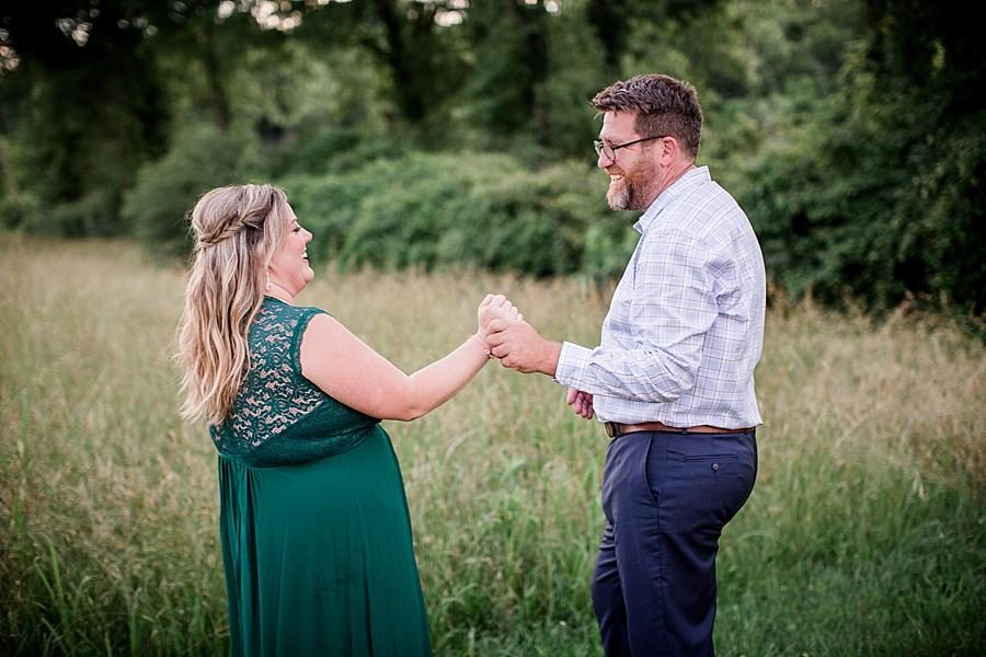 Dancing in the meadow at this Holston River Engagement Session by Knoxville Wedding Photographer, Amanda May Photos.