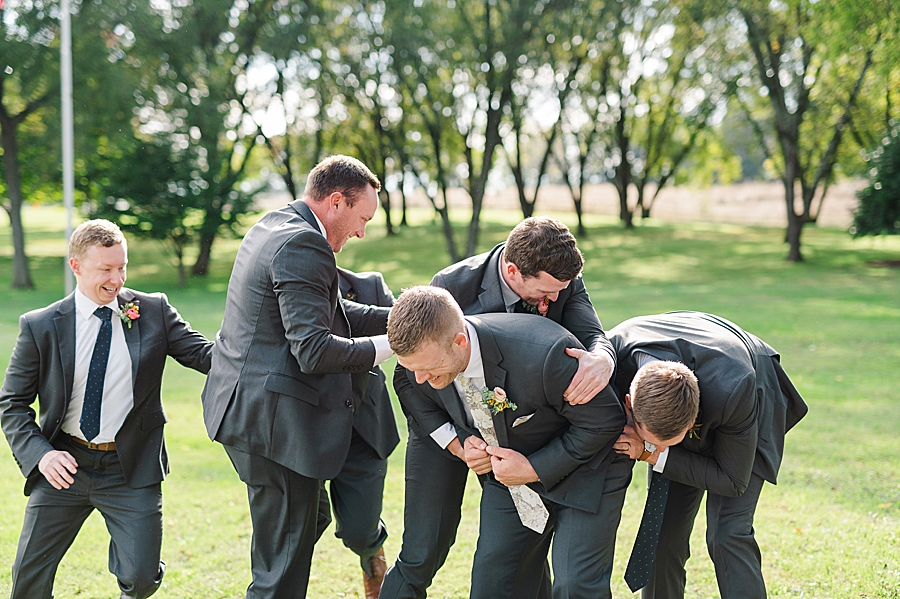 groomsmen being silly at this associate wedding at marblegate