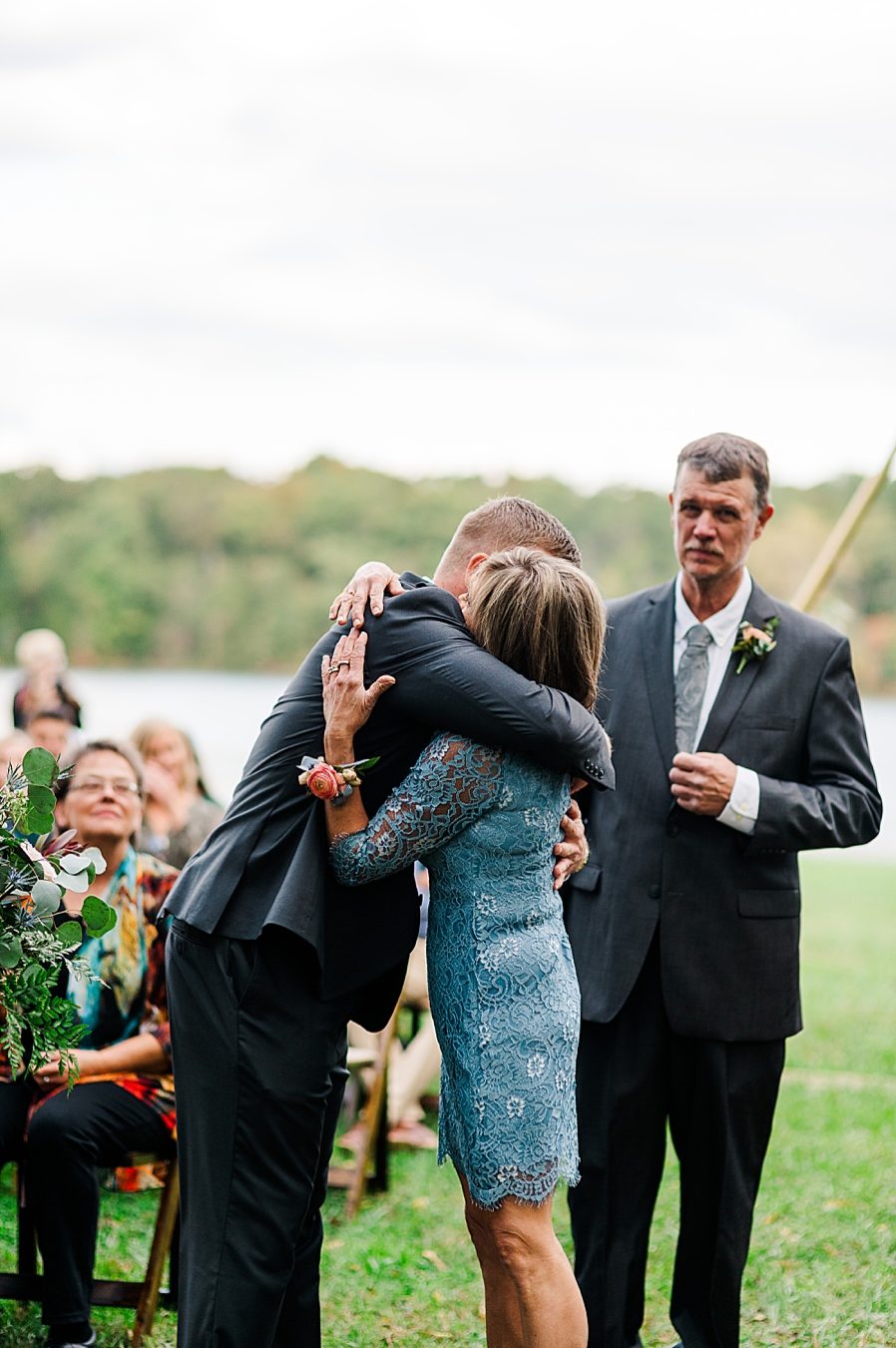 groom hugging mother at this associate wedding at marblegate