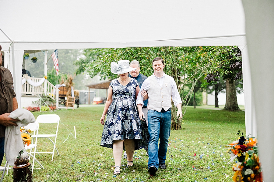 walking down the aisle at this backyard wedding