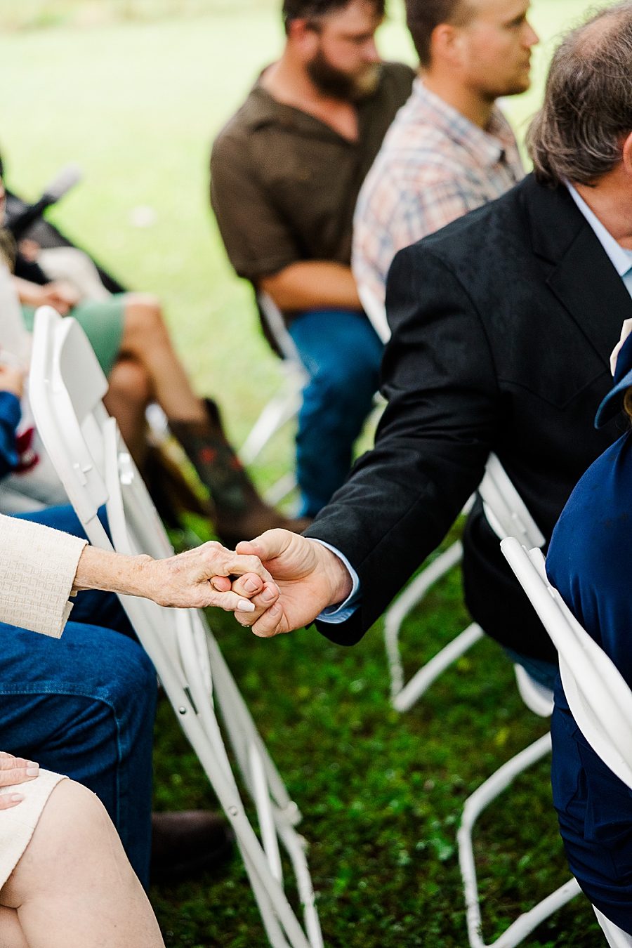 holding hands at this backyard wedding