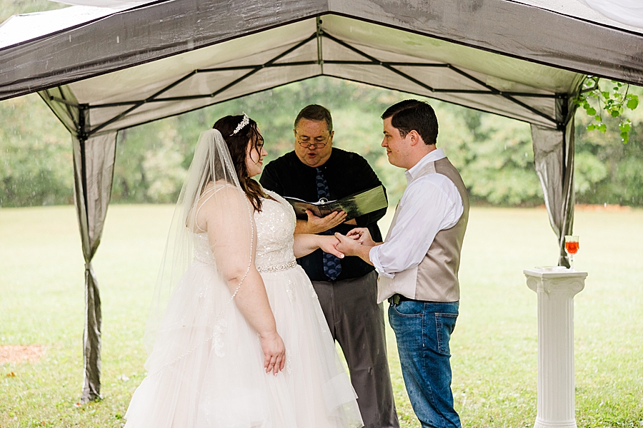 exchanging rings at this backyard wedding