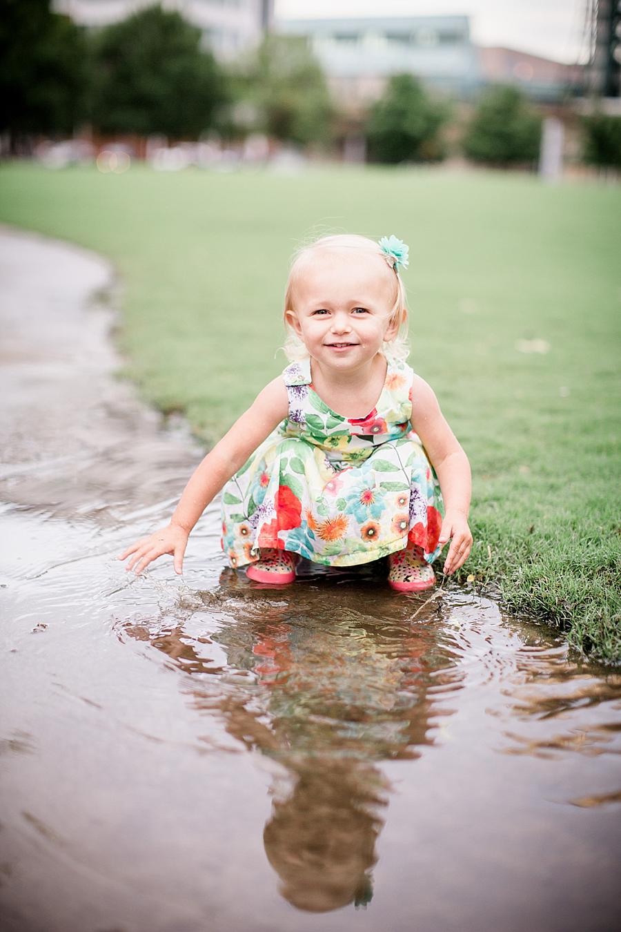 Playing in the water at this World's Fair Park session by Knoxville Wedding Photographer, Amanda May Photos.