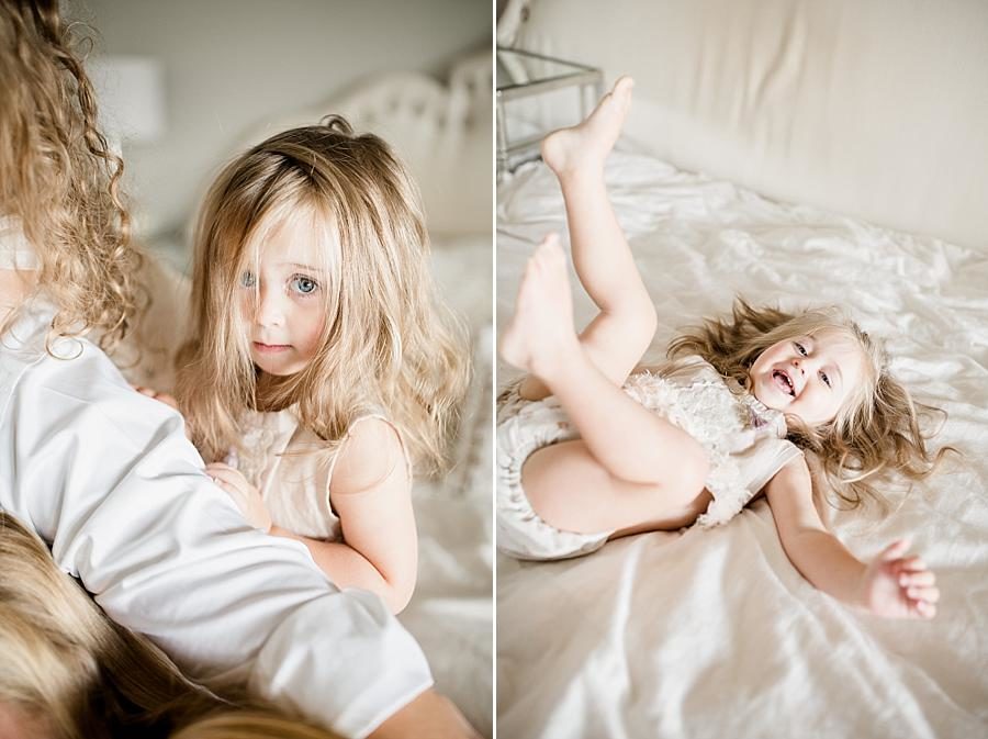 Laying on the bed at this Lifestyle Maternity Session by Knoxville Wedding Photographer, Amanda May Photos.
