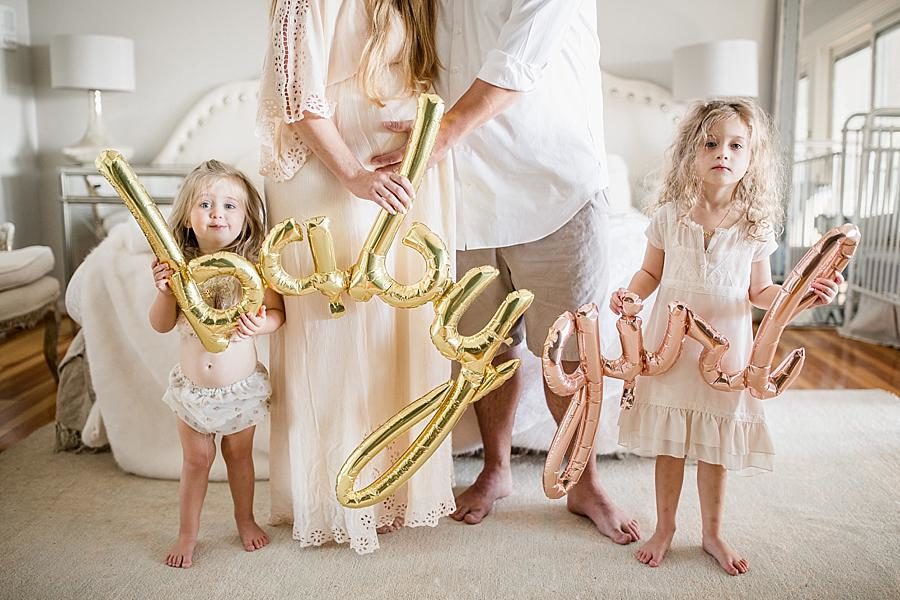 Baby girl balloons at this Lifestyle Maternity Session by Knoxville Wedding Photographer, Amanda May Photos.